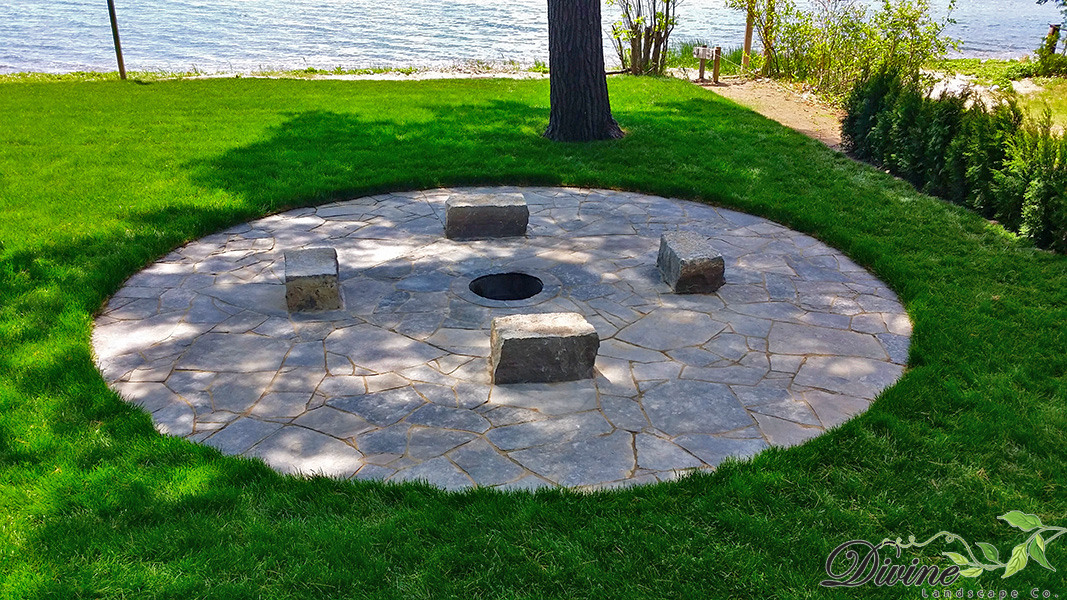 Tiny, ON - Random flagstone patio with armour stone seating